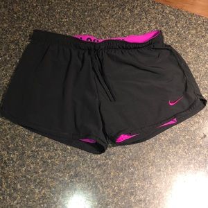 Black and pink nike shorts
